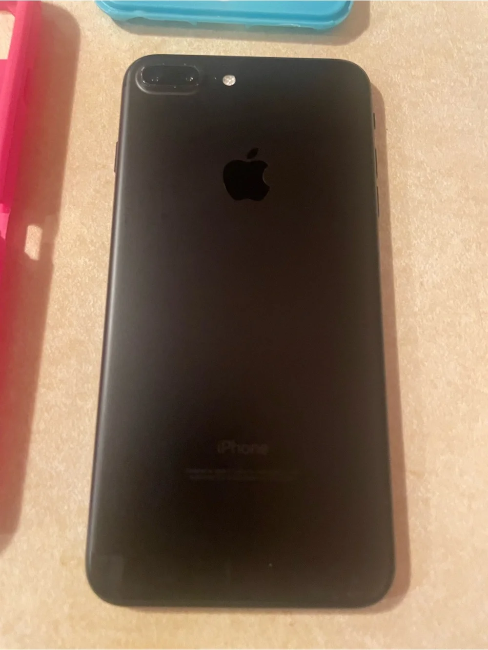 Apple IPhone 7 Plus with Pink and Teal Protective Phone Case with Front Frame.
